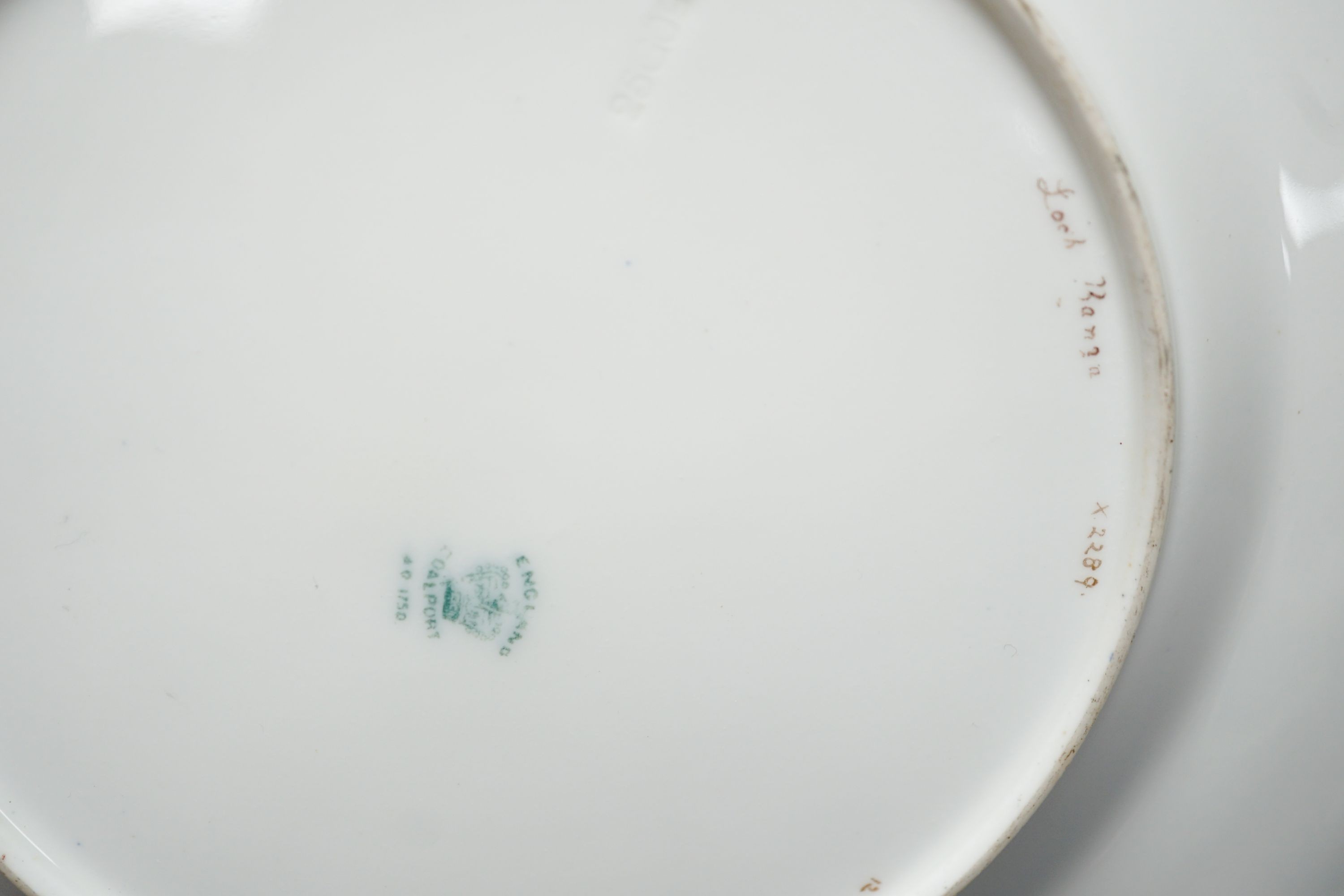 A pair of Coalport landscape plates painted by J. Oldfield with loch scenes, impressed date code for 1909, diameter 23cm